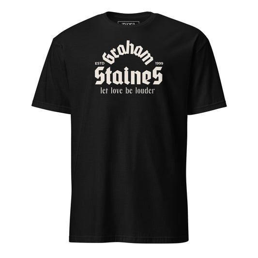 “Graham Staines – Let Love Be Louder” Christian Black graphic tee, inspired by 1 Corinthians 13:13. Faith-based gift, scripture-inspired apparel for men and women.