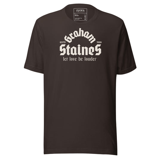 “Graham Staines – Let Love Be Louder” Christian Brown graphic tee, inspired by 1 Corinthians 13:13. Faith-based gift, scripture-inspired apparel for men and women.